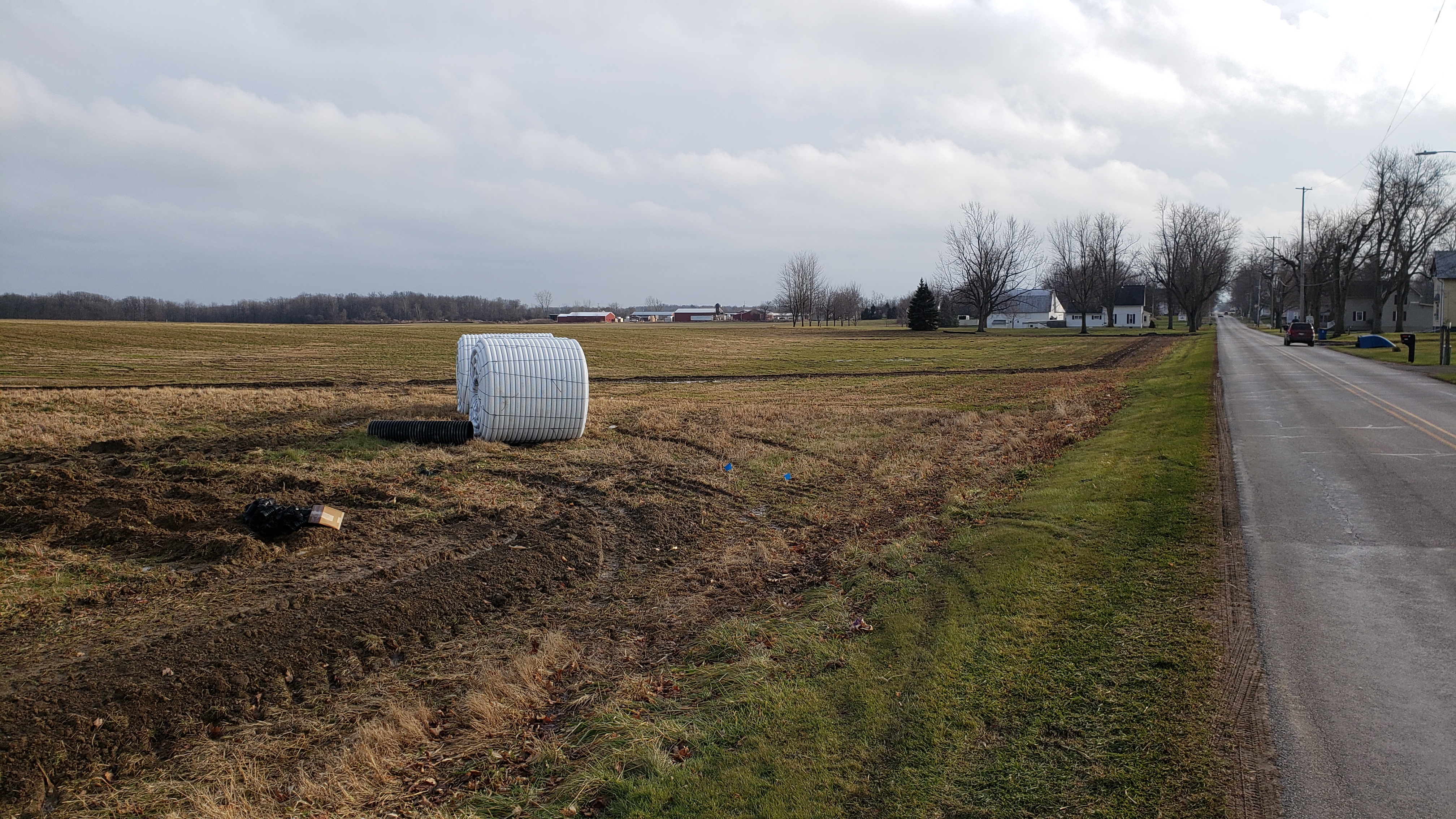Installing a drainage system in a field.